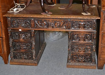 Lot 1216 - Victorian carved oak double pedestal desk with leather top, 121cm wide