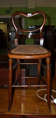 Lot 1219 - A single high chair with caned seat