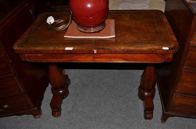 Lot 1229 - A mid-19th century rosewood writing table, with inset leather top, fitted with two drawers, on...