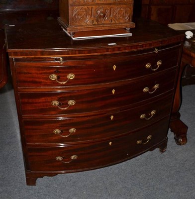 Lot 1230 - Regency mahogany bow fronted chest of drawers below a slide, with glass top