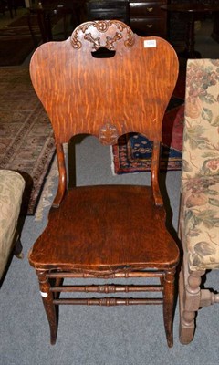 Lot 1232 - An oak side chair with shaped seat and backrest