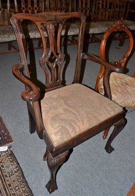 Lot 1236 - A carved George III style open armchair