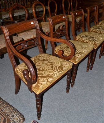 Lot 1237 - A set of six early 19th century mahogany dining chairs, including two carvers, carved roundel...