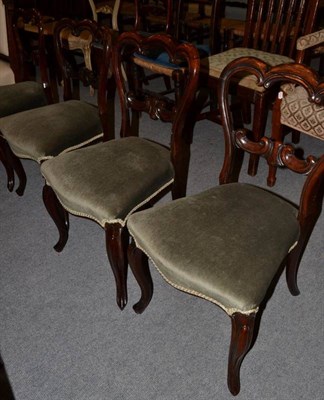 Lot 1244 - A set of four Victorian rosewood balloon back dining chairs