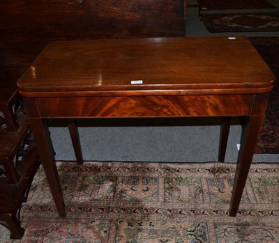 Lot 1252 - A D-shaped mahogany foldover tea table on square tapering supports