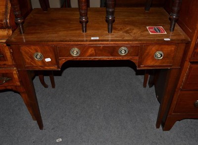 Lot 1258 - A crossbanded mahogany writing table