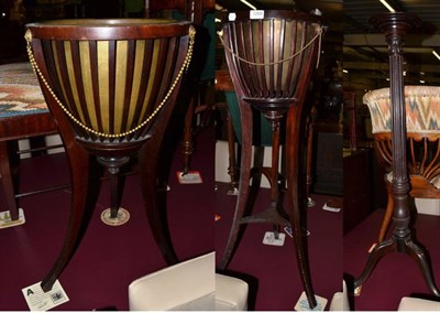 Lot 1269 - Two Edwardian mahogany jardiniere stands; and a mahogany plant pedestal (3)