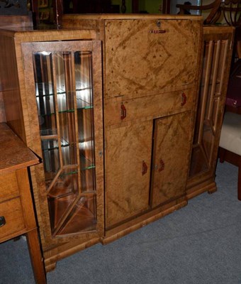 Lot 1270 - A 1950s walnut cocktail cabinet