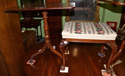 Lot 1274 - A George III mahogany tilt top tripod table, together with a carved mahogany piano stool on...