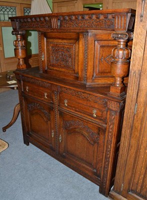 Lot 1276 - A 20th century carved oak court cupboard