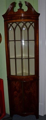 Lot 1280 - A Hunter & Smallpage reproduction mahogany part glazed standing corner cupboard