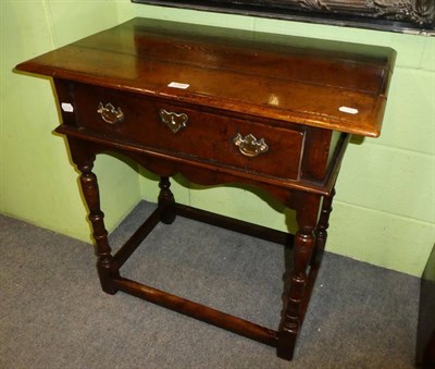 Lot 1285 - A 17th century style oak side table, fitted with a drawer