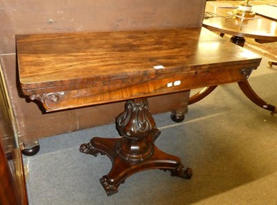 Lot 1302 - A 19th century rosewood fold over tea table