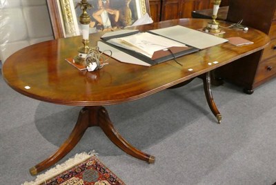 Lot 1309 - A reproduction mahogany twin pillar dining table