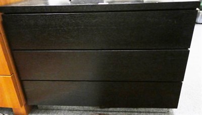 Lot 1317 - A modern black chest of drawers