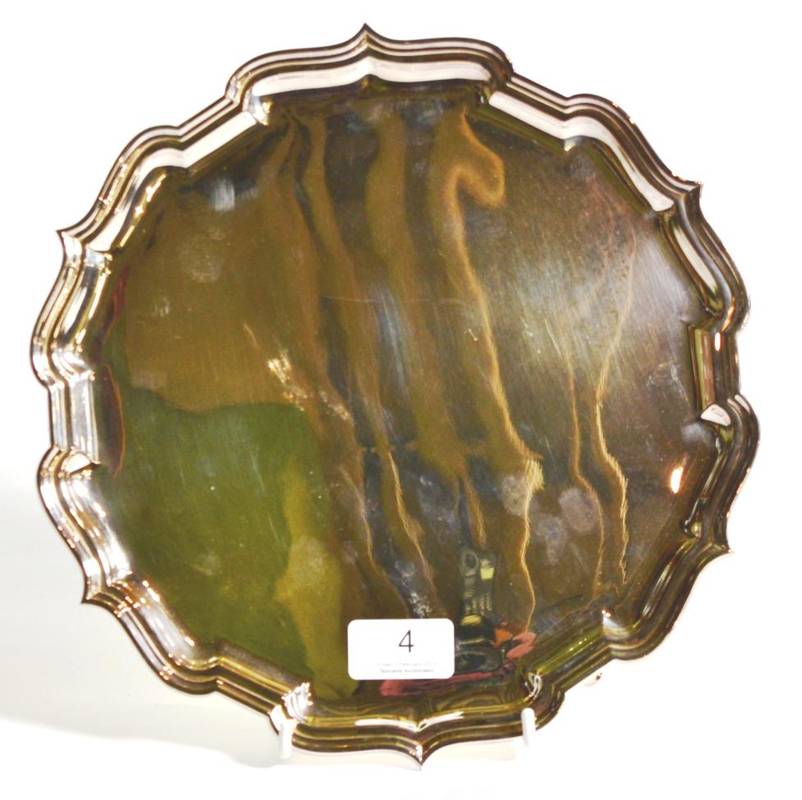 Lot 4 - A shaped circular silver salver, C J Vander, Sheffield 2004, 27cm diameter, 18.8ozt