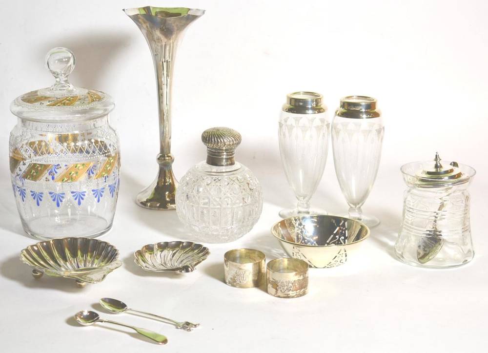 Lot 26 - Assorted silver items to include a posy vase; butter shells; various silver mounted glass items...
