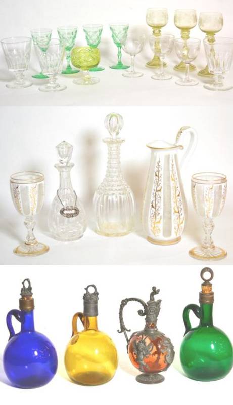 Lot 28 - Glassware comprising Victorian white-overlay jug and a pair of goblets; four coloured flagons;...