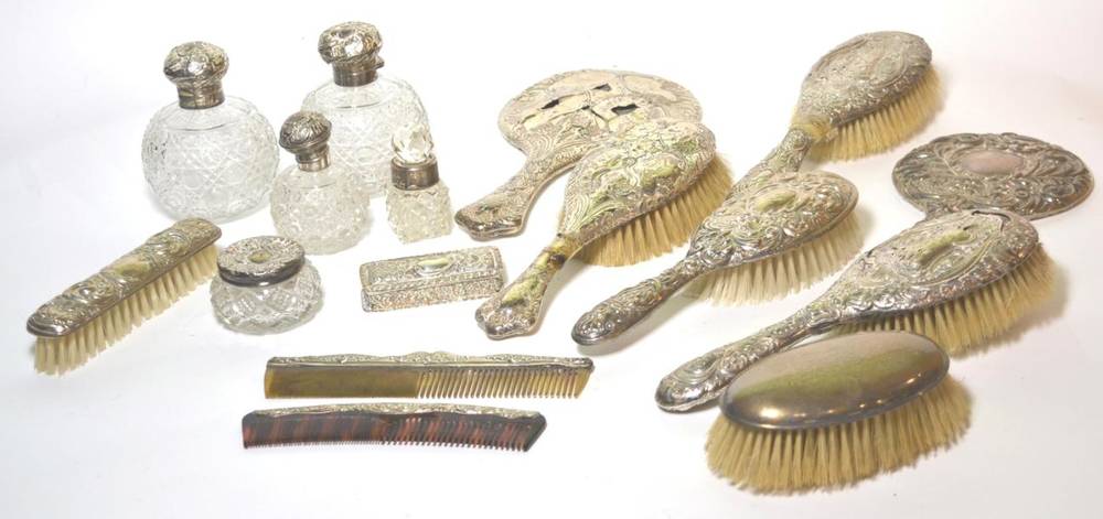Lot 30 - An assorted quantity of assorted silver mounted dressing table brushes, jars etc (many with...