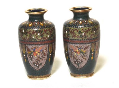 Lot 38 - A small pair of baluster vases with dragon designs