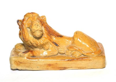 Lot 44 - A 19th century salt glaze figure of a lion