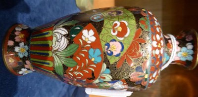 Lot 49 - A pair of cloisonne enamelled vases with floral designs, with stands