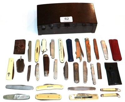 Lot 62 - A cigarette box and contents of pen knives