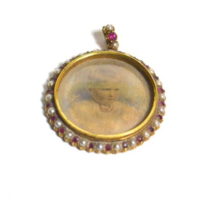 Lot 77 - An Edwardian 18 carat gold ruby and pearl child portrait pendant