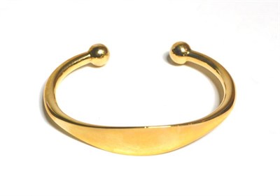 Lot 78 - A 9 carat gold torque bangle