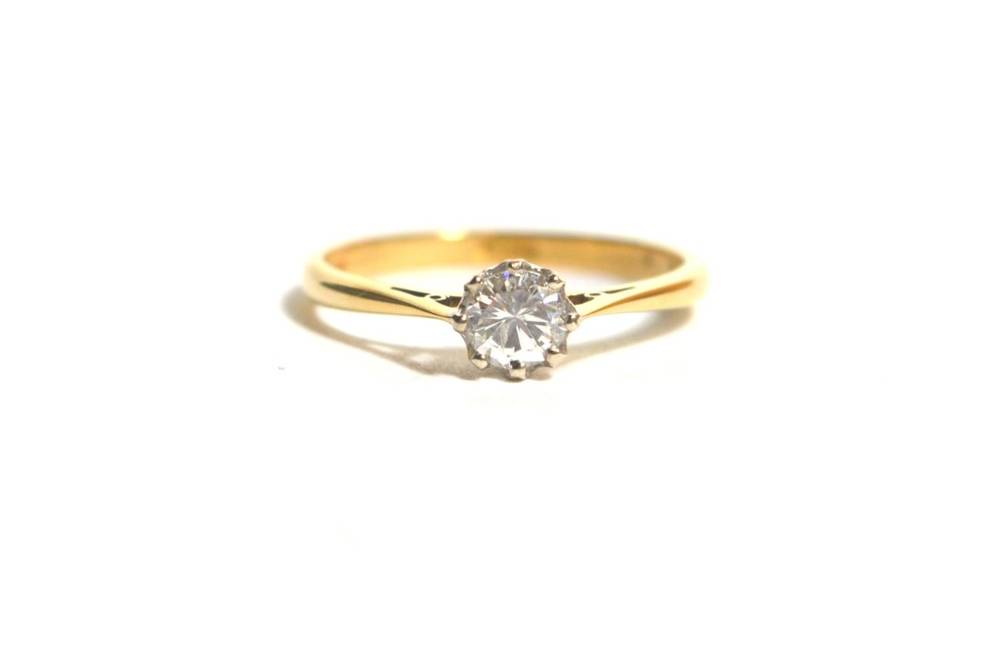 Lot 79 - An 18 carat gold solitaire diamond ring, a round brilliant cut diamond in a claw setting, to...