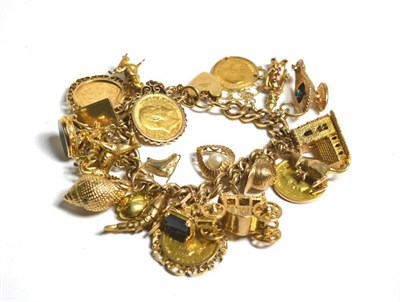 Lot 112 - A gold charm bracelet set with three sovereigns, one half sovereign and twenty charms, 167g