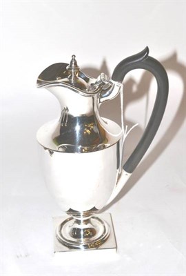 Lot 138 - An Edwardian silver pedestal hot water jug, David Munsey, London 1905, 21cm high, 12.5ozt