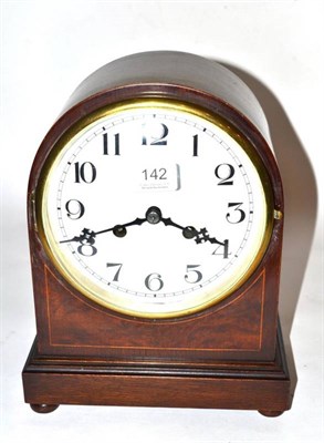 Lot 142 - A mahogany veneered striking mantle clock, arched case, circa 1920