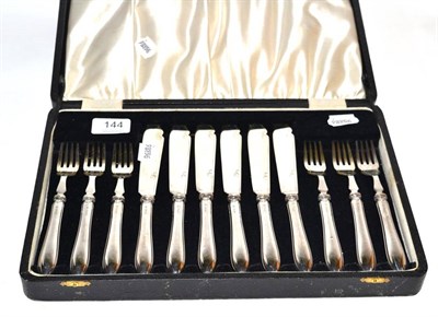 Lot 144 - A cased six piece silver handled fish knife and fork set, Birmingham marks