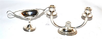 Lot 151 - A silver twin branch candlestick, Birmingham 1996; and a twin handled silver pedestal dish,...