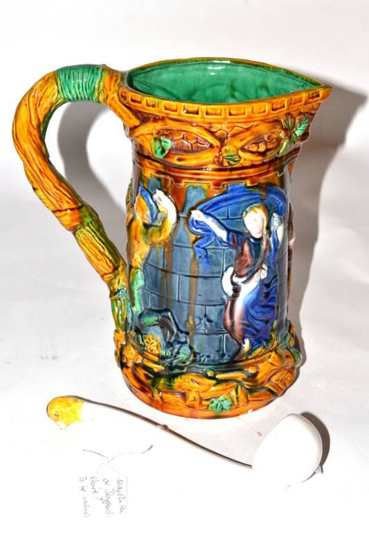 Lot 154 - A Majolica jug, figural design; with a Victorian ladle (2)