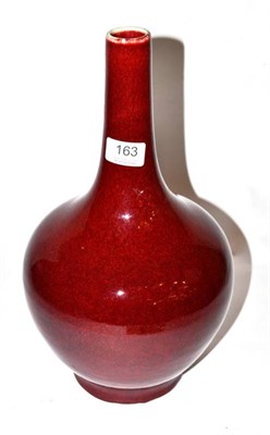 Lot 163 - A Chinese sang de boeuf bottle vase, narrow neck, footed base, 36cm high