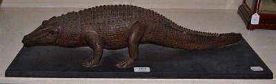 Lot 181 - A resin model of a Crocodile in walking pose, mounted upon a slate base