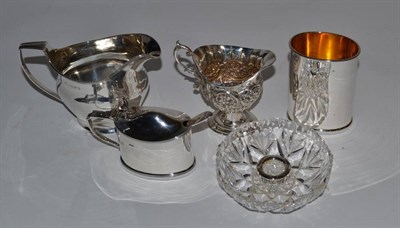 Lot 213 - A George III silver cream jug, London 1802; a silver mustard pot Chester 1902; a decorative...