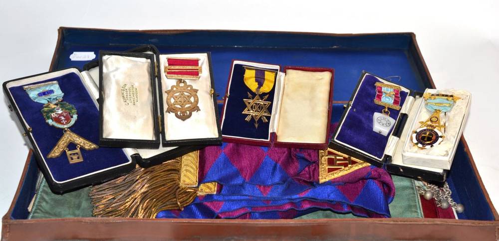 Lot 217 - A leather case containing Masonic regalia and a quantity of silver gilt Masonic jewels