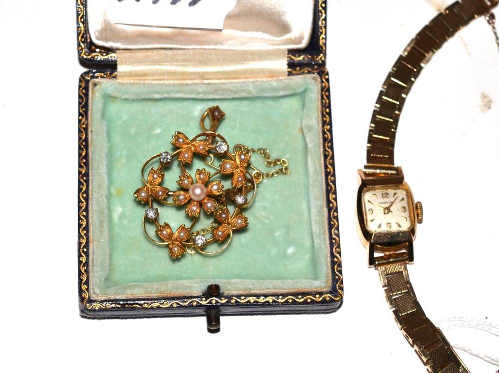 Lot 222 - A 9 carat Marvin lady's wristwatch; together with a 15 carat diamond and seed pearl brooch, stamped