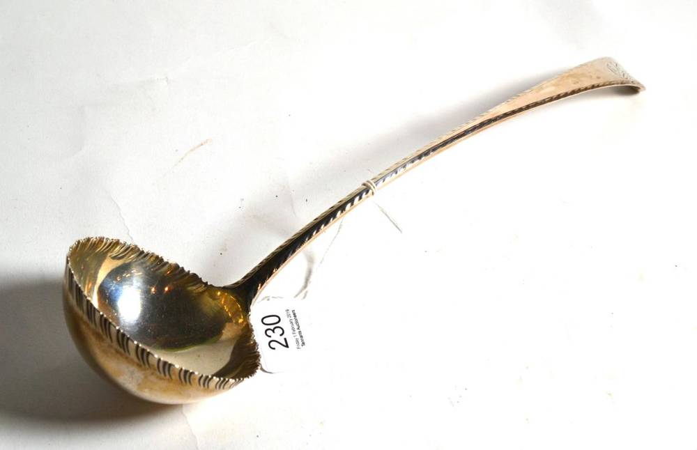 Lot 230 - A George III silver feather edge soup ladle, Thomas Evans, London, date letter indistinct circa...