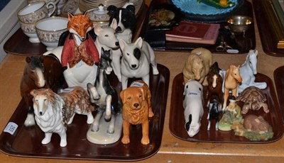 Lot 253 - Seventeen various animal figures including Wade, Royal Doulton, Sylvac etc (two trays)