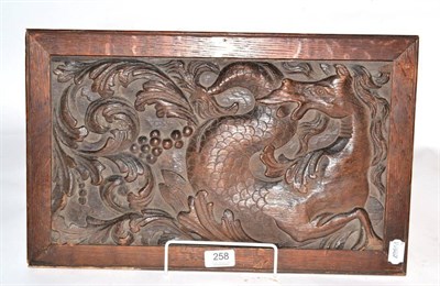 Lot 258 - A carved oak panel