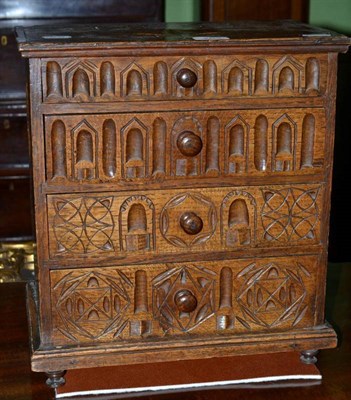 Lot 263 - 1851 carved oak miniature chest of four drawers
