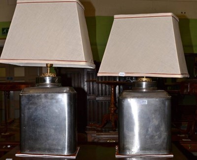 Lot 264 - A pair of rectangular metal canister table lamps, with shades