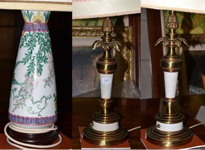 Lot 267 - A pair of large gilt metal table lamps and a porcelain table lamp (3)
