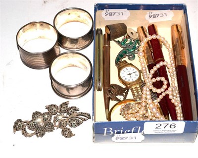 Lot 276 - Three silver napkin rings; pearl necklace with clasp stamped 9ct; 9 carat gold pencil; pens; silver