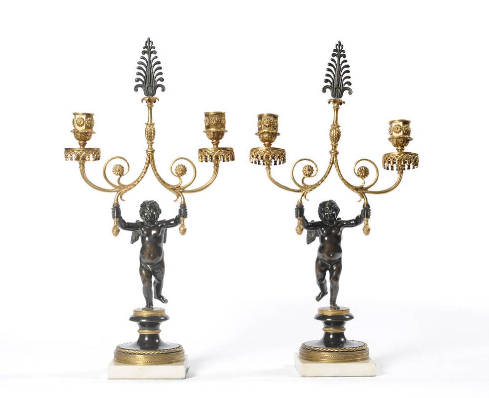 Lot 1329 - A Pair of French Parcel Gilt Bronze Figural Two-Branch Candelabra, 19th century, each as a...