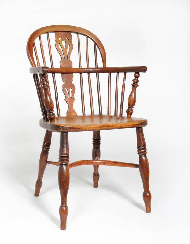 Lot 1483 - A 19th Century Yew and Elm Windsor Armchair, the low double bow back with a pierced splat and...